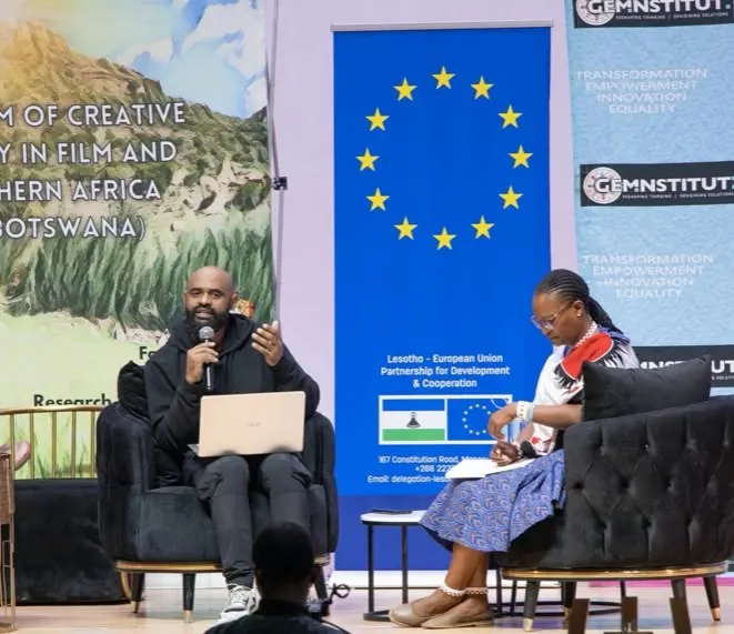 A panel conversation on the creative economy in film, staged beside the Lesotho–European Union partnership banner.