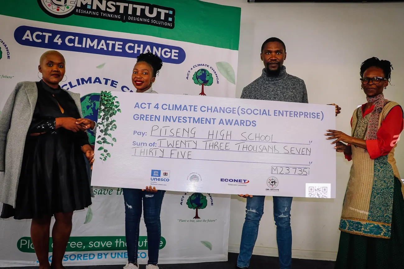 An oversized award cheque for M23,735 is presented to Pitseng High School at the Act 4 Climate Change Green Investment Awards.
