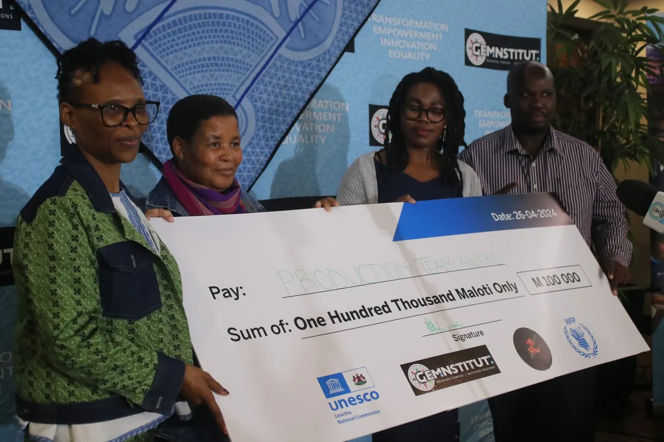 A M100,000 Production Team Award cheque is presented at a GEM Institute ceremony supported by UNESCO and WFP.
